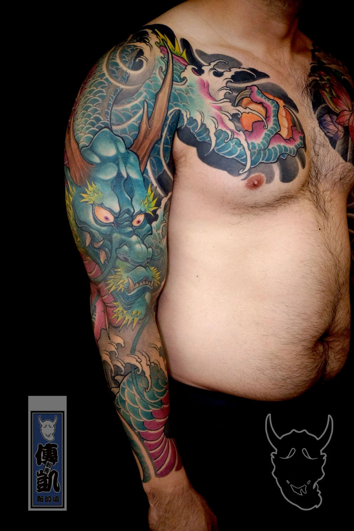 Japanese dragon arm sleeve tattoo featuring a fierce dragon face and dynamic wave patterns, symbolizing power, courage, and spiritual protection in Irezumi art.