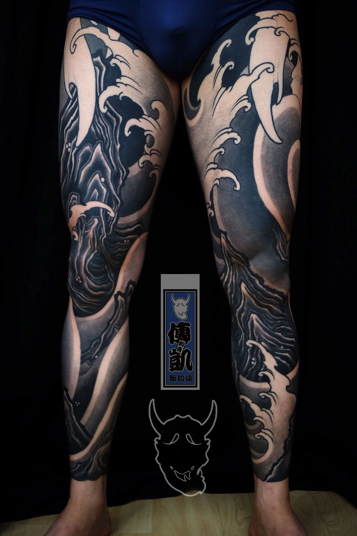 New Traditional Japanese full leg tattoo in black and grey featuring waves and rocks, symbolizing balance between strength and flow. CK Tattoo Singapore.
