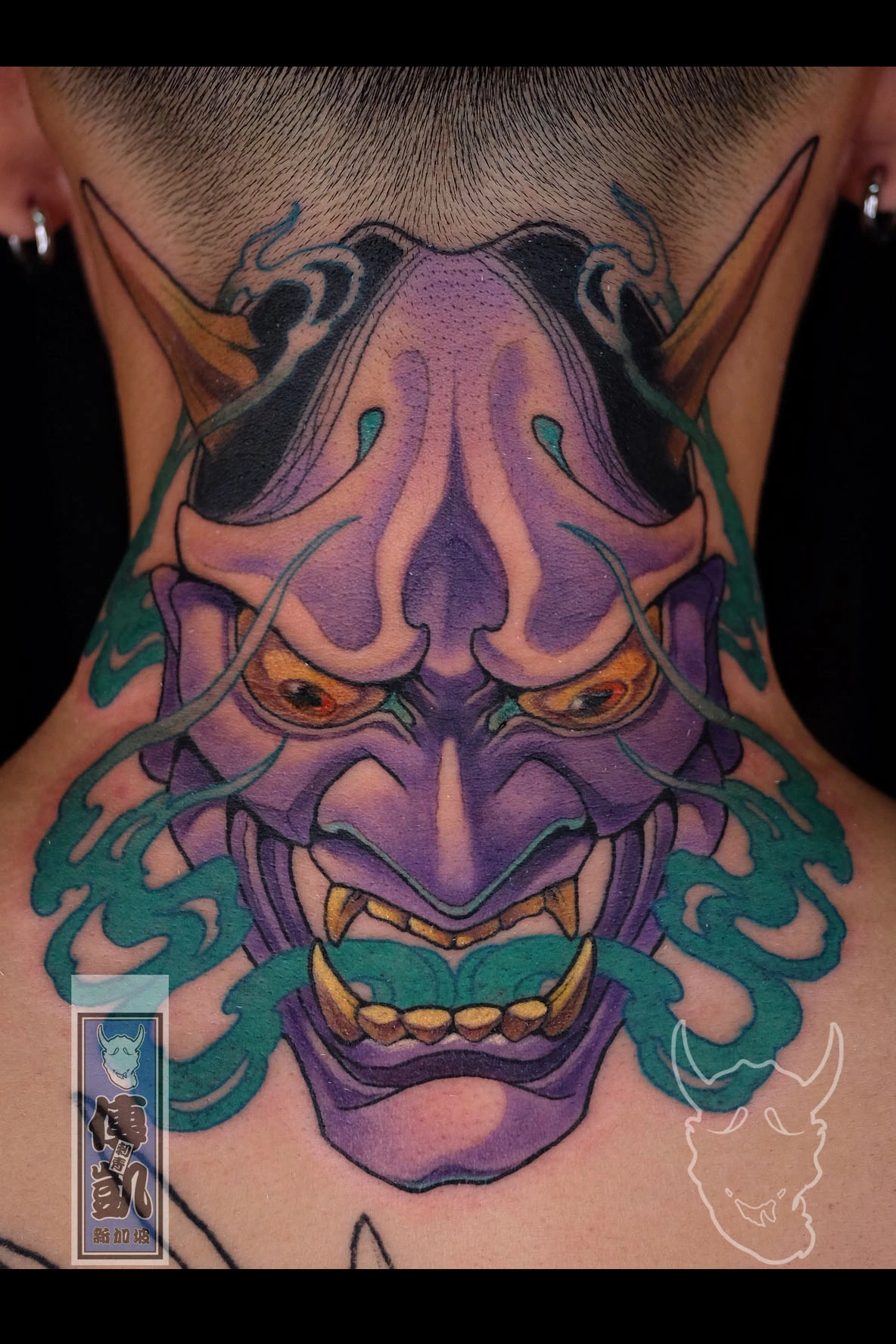 Purple Japanese Hannya mask tattoo on the back of the neck with gold horns and teal smoke, symbolizing passion, jealousy, and transformation. Artwork by CK Tattoo Singapore.
