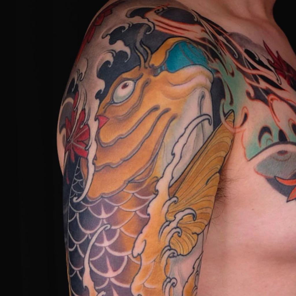 Japanese yellow koi fish full sleeve tattoo with momiji maple leaves and black and grey waves by CK Tattoo Singapore