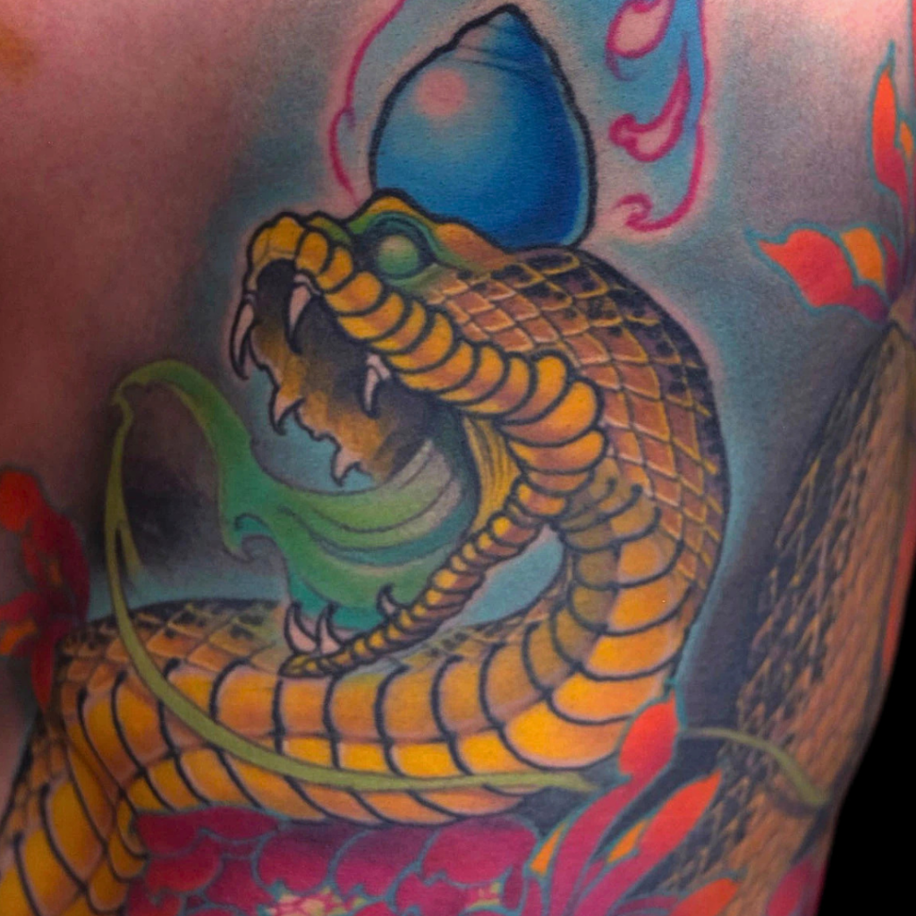 Japanese Tibetan skull Kapala and red snake full leg tattoo with flames and waves by CK Tattoo Singapore
