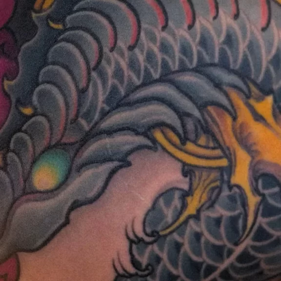 New Traditional Japanese tattoo of a snake and chrysanthemum, full backpiece with detailed linework, balance, and dynamic composition.